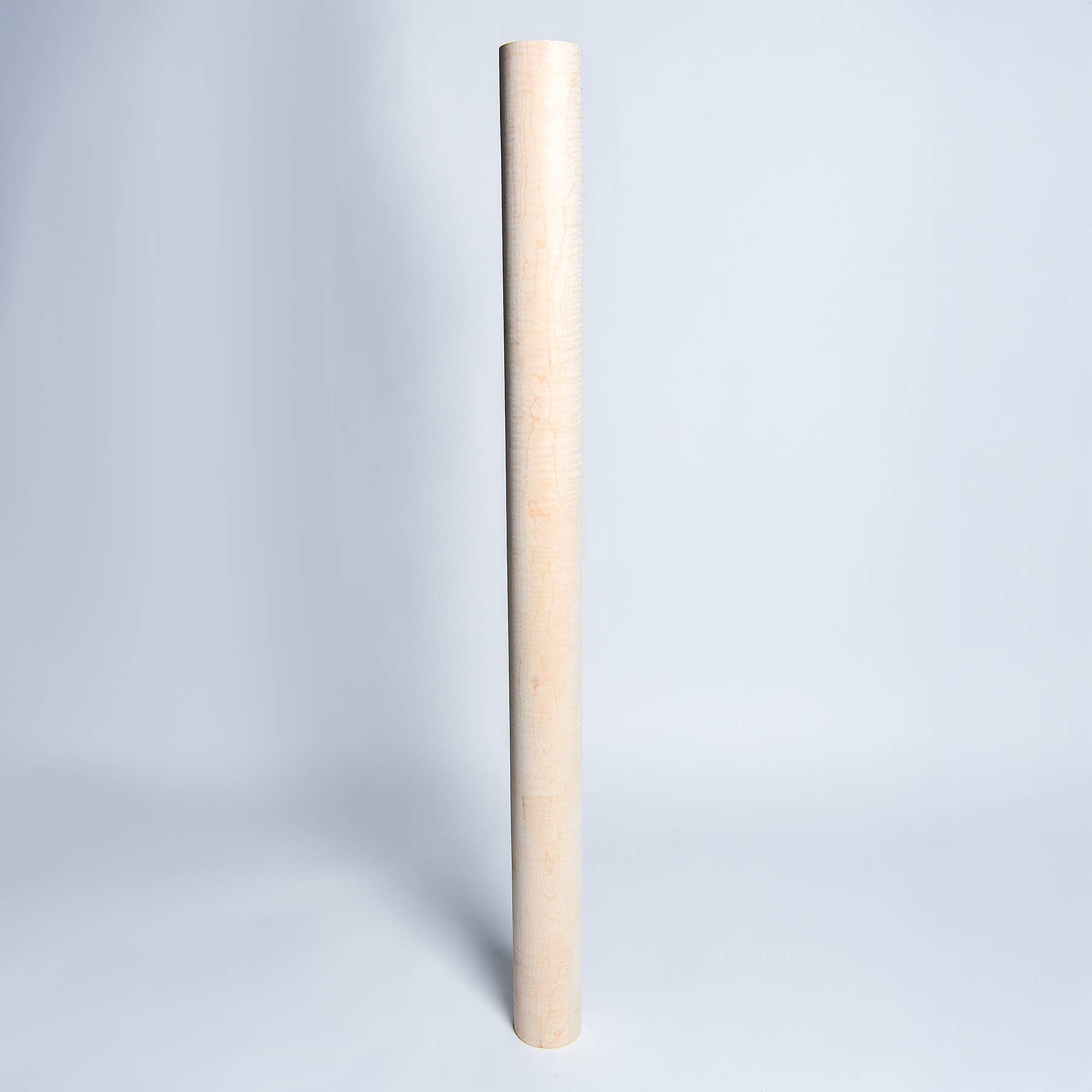 Standing upright, a Curly Maple Wood Billet from Great Lakes Billets